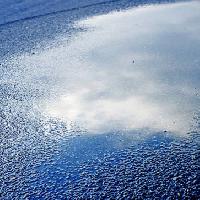 Pixwords Com a imagem de água, asfalto, céu, reflexão, estrada Bellemedia - Dreamstime